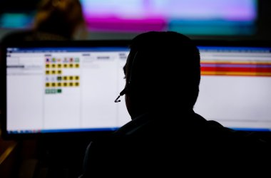 Shallow depth of field (selective focus) image with 112 emergency number operator (Romanian version of 911) having a conversation with a distress caller Shallow depth of field (selective focus) image with 112 emergency number operator (Romanian version of 911) having a conversation with a distress caller