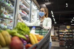 Woman with protective mask and gloves shopping in supermarket during COVID-19 pandemic or corona virus. Protect yourself against highly contagious coronavirus. Woman with protective mask and gloves shopping in supermarket during COVID-19 pandemic or corona virus. Protect yourself against highly contagious coronavirus.