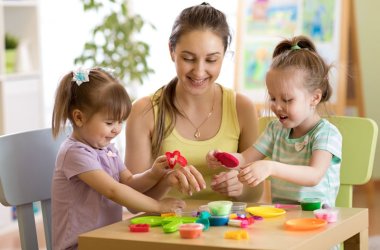 Children and mother play colorful clay toy