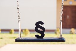 Black paragraph symbol on children chain swing. Black paragraph symbol on children chain swing.
